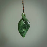 Hand carved New Zealand jade, single twist pendant. Maori pikorua pendant hand carved in New Zealand. Made by NZ Pacific, jade jewellery for sale online. One only hand made by Ross Crump.