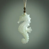 A hand carved Jadeite seahorse pendant. We have carved this from beautiful jadeite and we bind them with our hand-plaited cords. The cords are a waxed polyester so they are durable and strong. We ship these worldwide with express courier anywhere in the world.