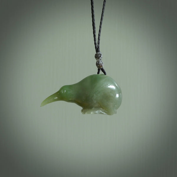Hand carved Jade kiwi pendant for lovers of birds. Hand made kiwi necklace with black adjustable cord. Unique gifts and Art to Wear by NZ Pacific.