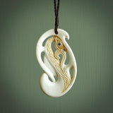 Bone carving of a taniwha. A three dimensional pendant carved in bone by Andrew Doughty. One only taniwha carving for men and women. Provided with an adjustable cord.