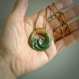 This pendant is a complex koru design. Carved in gorgeous New Zealand jade it is a medium sized pendant that can be worn by anyone. Hand made in New Zealand by NZ Pacific.