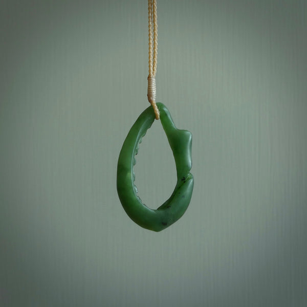 Hand carved contemporary jade broken sea shell jewellery. Made by Donna Summers for NZ Pacific from New Zealand greenstone. Authentic jade jewellery for sale online. These are a beautiful and feminine necklace and would make the perfect gift for the women in your life.