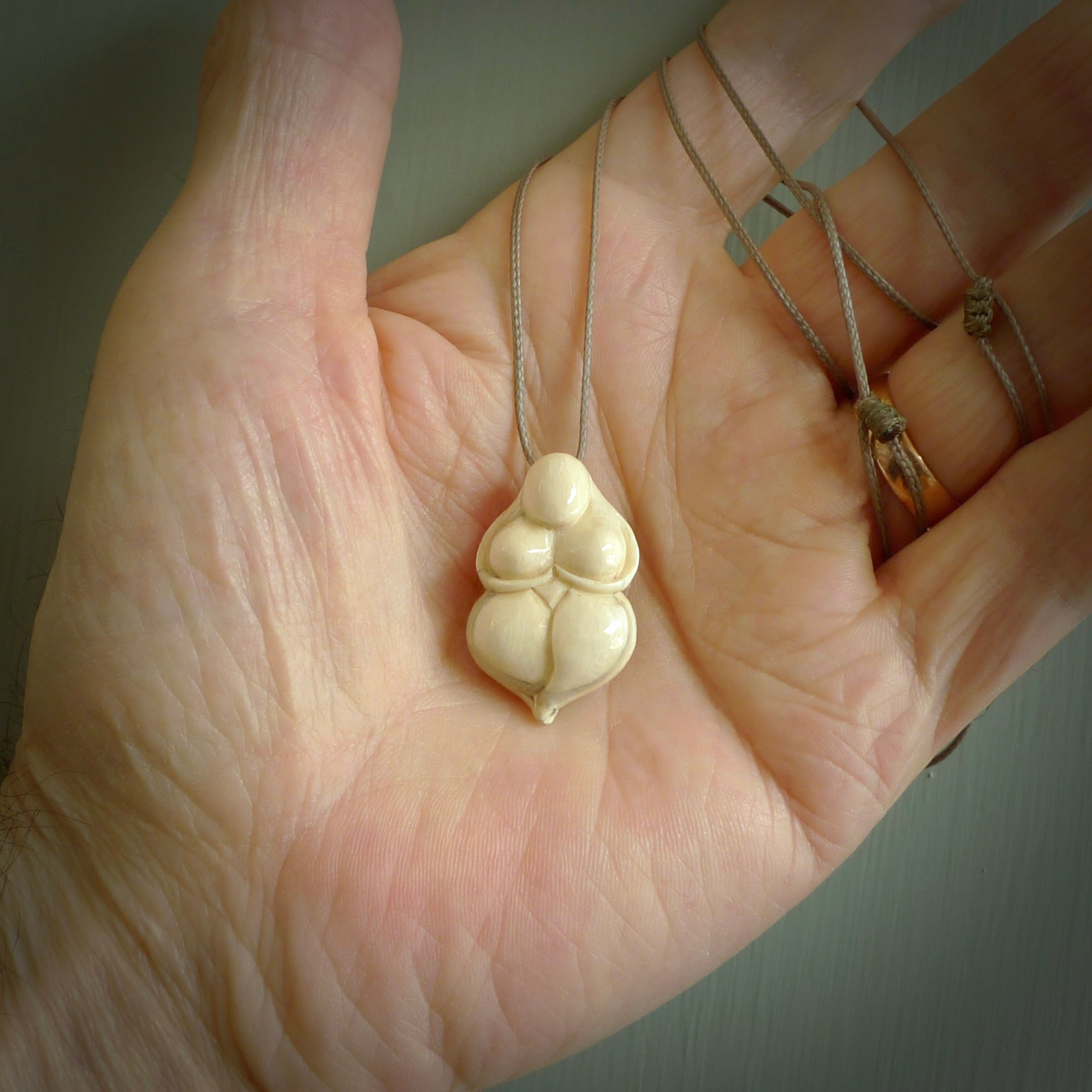 Hand carved mammoth tusk goddess pendant. Hand carved Mammoth Tusk jewellery for sale online by NZ Pacific.