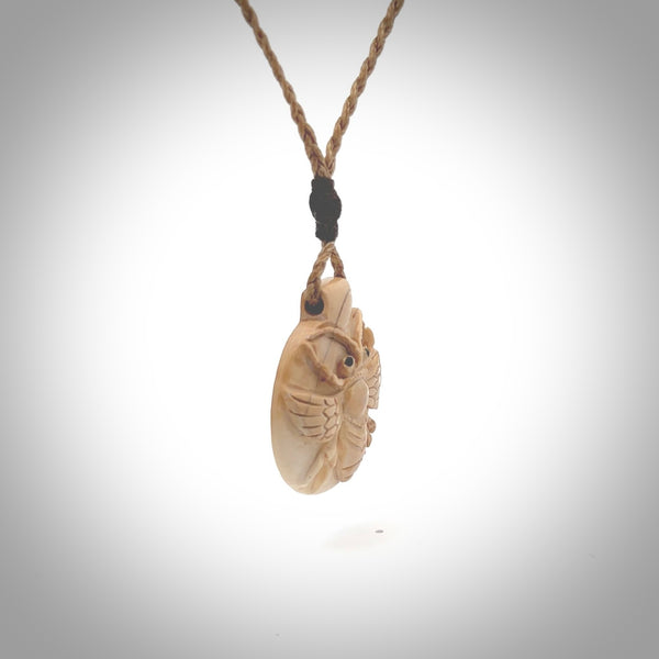 This is a handcarved pendant depicting a beetle on the front face. it is carved from Woolly Mammoth tusk and is a beautiful creamy, golden colour. A lovely and unique necklace for those of us who are fascinated with beetles.