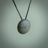 A drop pendant made from Onewa Stone - New Zealand Greywacke - with a fine Pounamu insert spliced into the middle.