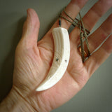 Hand carved Boars tusk pendant. Polynesian carving. South Pacific art. Handmade by NZ Pacific. Unique handmade jewellery for sale online.