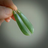 These are stunning large wing shaped drop jade earrings carved in New Zealand by Josey Coyle. It is carved from a apple green piece of New Zealand Jade and with Sterling Silver hooks.