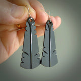 This picture shows Australian Black jade feather earrings with sterling silver hooks. Hand made unique and contemporary feather earrings by Kerry Thompson. Hand carved here in New Zealand from Black Jade. One pair only.