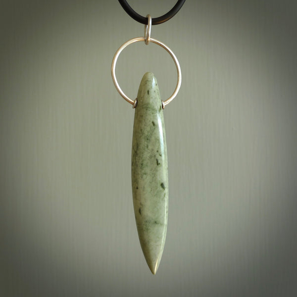A photo of a New Zealand Jade drop pendant with sterling silver. This is a stylish statement piece - hand crafted here in New Zealand by Ana Krakosky. Unique Art to Wear. Gifts for all lovers of hand made Art to Wear.