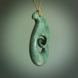 A hand carved koru pendant from New Zealand Jade. The cord is a tan colour and is adjustable. A large hand made Koru necklace by New Zealand artist Kerry Thompson.