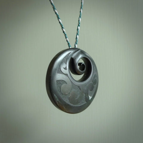Hand made large New Zealand Pounamu, Jade Koru pendant. Hand carved in New Zealand by Rueben Tipene. Hand made jewellery. Unique large Greenstone Koru with adjustable cobalt blue/maui blue cord. Free shipping worldwide.