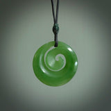 Hand carved New Zealand Inanga jade koru pendant. Carved for NZ Pacific by Ross Crump. Jade jewelry for sale online exclusively with NZ Pacific.