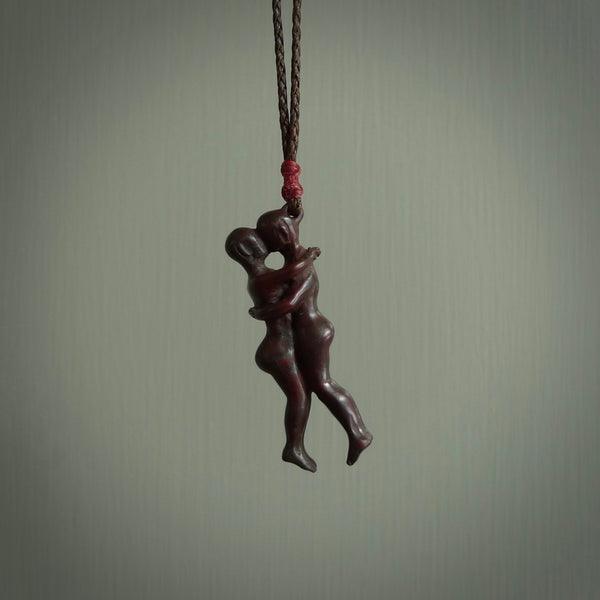 This medium sized couples embrace pendant is made from Red Jasper Stone. We've hand carved this piece for all the lovers out there. Free postage worldwide. Red Jasper Stone couple hugging jewellery.