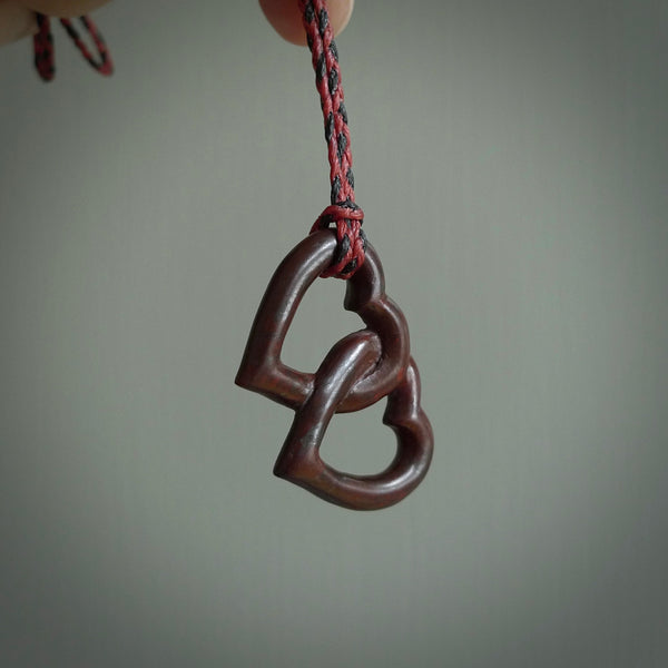 Hand carved double heart pendant made in black jade, green jade and jasper stone. Made by NZ Pacific. Carved from green jade, black jade and red jasper stone. Free delivery worldwide.