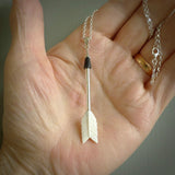 Hand carved arrow made from bone and sterling silver - this is a pendant provided with a sterling silver chain. NZ Pacific pendant for sale online. Hand made archers arrow necklace with sterling silver. One only art to wear.