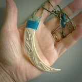 Boars Tusk Pendant with a jade cap. Hand made pendant carved from a boars tusk. Hand made ethnic or maori jewellery for sale by NZ Pacific online.