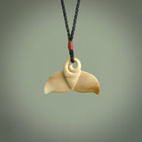 Hand carved whale tail pendant. Carved from woolly mammoth tusk in 10,000 year old mammoth tusk. A rare and original handmade pendant for ocean lovers.