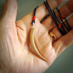 Hand carved incredible Huia bird beak woolly mammoth tusk carving. A stunning work of art, beautifully replicating a hula bird beak. This pendant was hand carved in mammoth tusk by artist Sami. A one off collectors item that has been hand crafted to be worn or displayed.