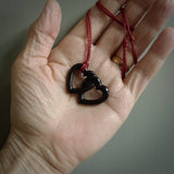 Hand carved double heart pendant made in black jade, green jade and jasper stone. Made by NZ Pacific. Carved from green jade, black jade and red jasper stone. Free delivery worldwide.