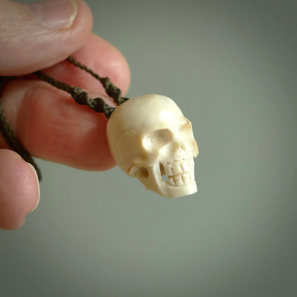 These are little handmade skull pendants carved from deer antler. A fantastic piece if you like skulls and would like a small piece. The cord is adjustable so you can wear this where it suits you best. We ship these free worldwide.