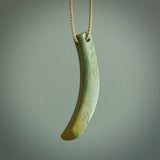 Hand carved pounamu drop pendant. Jade necklace hand made in New Zealand. A contemporary drop pendant carved from rare New Zealand flower jade. NZ Pacific jade jewellery for sale online.