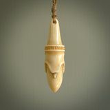 Hand carved incredible stained bone gargoyle face carving. A stunning work of art. This pendant was hand carved in bone with buffalo horn inlay for the eyes by Yuri Terenyi. A one off collectors item that has been hand crafted to be worn or displayed.