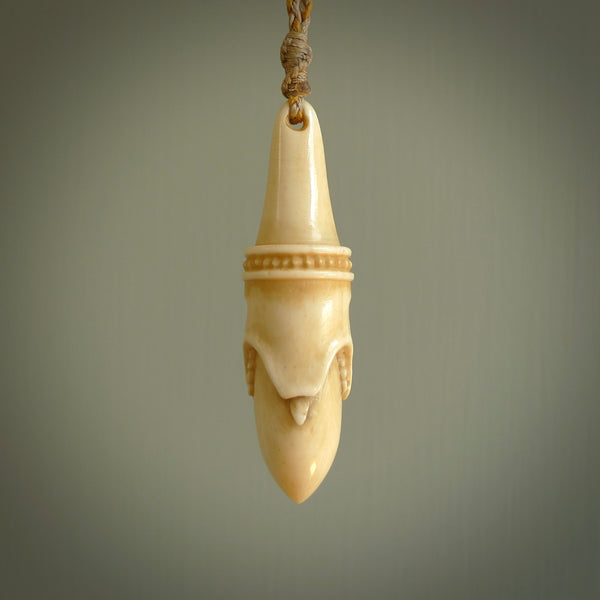 Hand carved incredible stained bone gargoyle face carving. A stunning work of art. This pendant was hand carved in bone with buffalo horn inlay for the eyes by Yuri Terenyi. A one off collectors item that has been hand crafted to be worn or displayed.