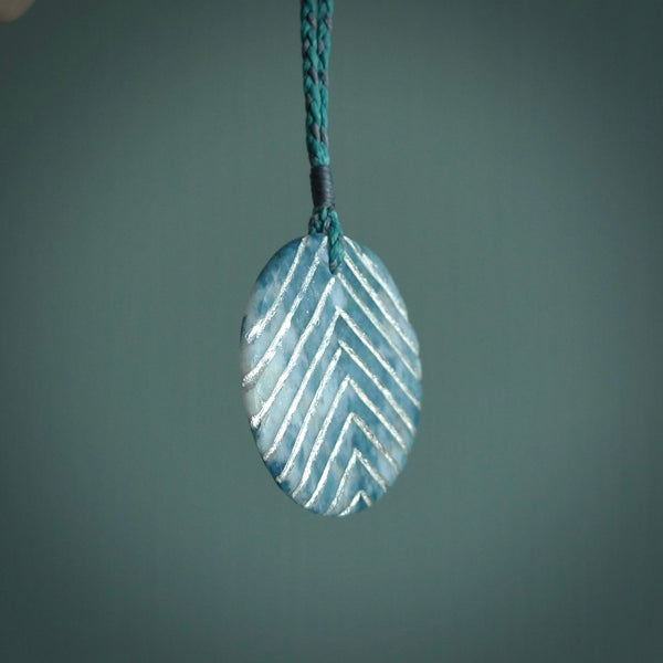 This is a handcrafted aotea stone pendant. This is a solid little work of art. We ship this worldwide for free and are happy to answer any questions that you may have about these or other products on our website.