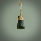 Hand carved jade toki by Ric Moor. Made in New Zealand by NZ Pacific. Hand carved Toki pendants crafted from beautiful New Zealand Pounamu, Jade. We deliver these with Express Courier, on adjustable cords.