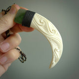 Boars Tusk Pendant with a jade cap. Hand made pendant carved from a boars tusk. Hand made ethnic or maori jewellery for sale by NZ Pacific online.