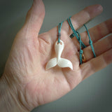 Hand carved bone whale tail pendant. Made by NZ Pacific. Bone whale tail necklace with adjustable cord.