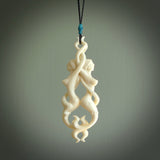 A hand carved bone double mermaid pendant. This is a work of art carved by Yuri Terenyi who is renowned for his skill in bone carving. Art to wear for lovers of collectable art. Delivered with Express Courier. Provided on a black adjustable cord.
