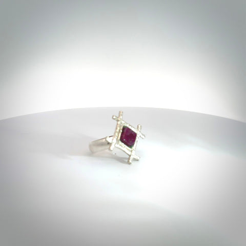 This is a handcrafted New Zealand Ruby, stone with sterling silver ring. This is a solid little work of art. We ship this worldwide for free and are happy to answer any questions that you may have about these or other products on our website. Hand made by Ana Krakosky and delivered in a woven kete pouch.