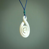 Hand carved bone twist with koru pendant. Real natural bone. These are suspended on a length adjustable plaited cord.