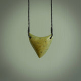 This is a lovely New Zealand Jade, pounamu drop pendant. Hand carved for us by Ric Moor. It is bound with an adjustable black coloured cord which is length adjustable. Free worldwide shipping.