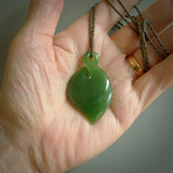 Hand carved New Zealand jade, single twist pendant. Maori pikorua pendant hand carved in New Zealand. Made by NZ Pacific, jade jewellery for sale online. One only hand made by Ross Crump.