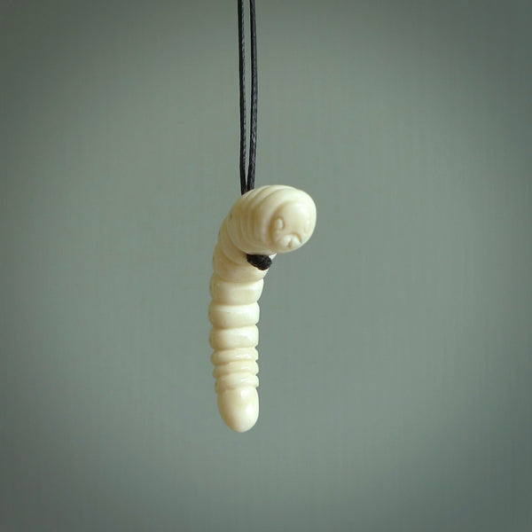 Hand carved huhu bug  pendant, carved for us by Fumio Noguchi. This piece is carved from bone and is a fantastic depiction of these bugs. This particular piece is a huhuh bug design and is lovingly carved. Free shipping worldwide.