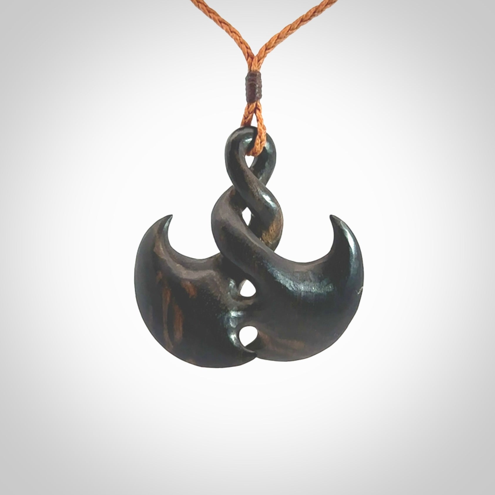Hand carved hard wood contemporary twist pendant. Made by NZ Pacific. Shipping included in the price. Hand made hardwood twist necklace delivered on an adjustable cord.