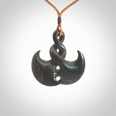 Hand carved hard wood contemporary twist pendant. Made by NZ Pacific. Shipping included in the price. Hand made hardwood twist necklace delivered on an adjustable cord.