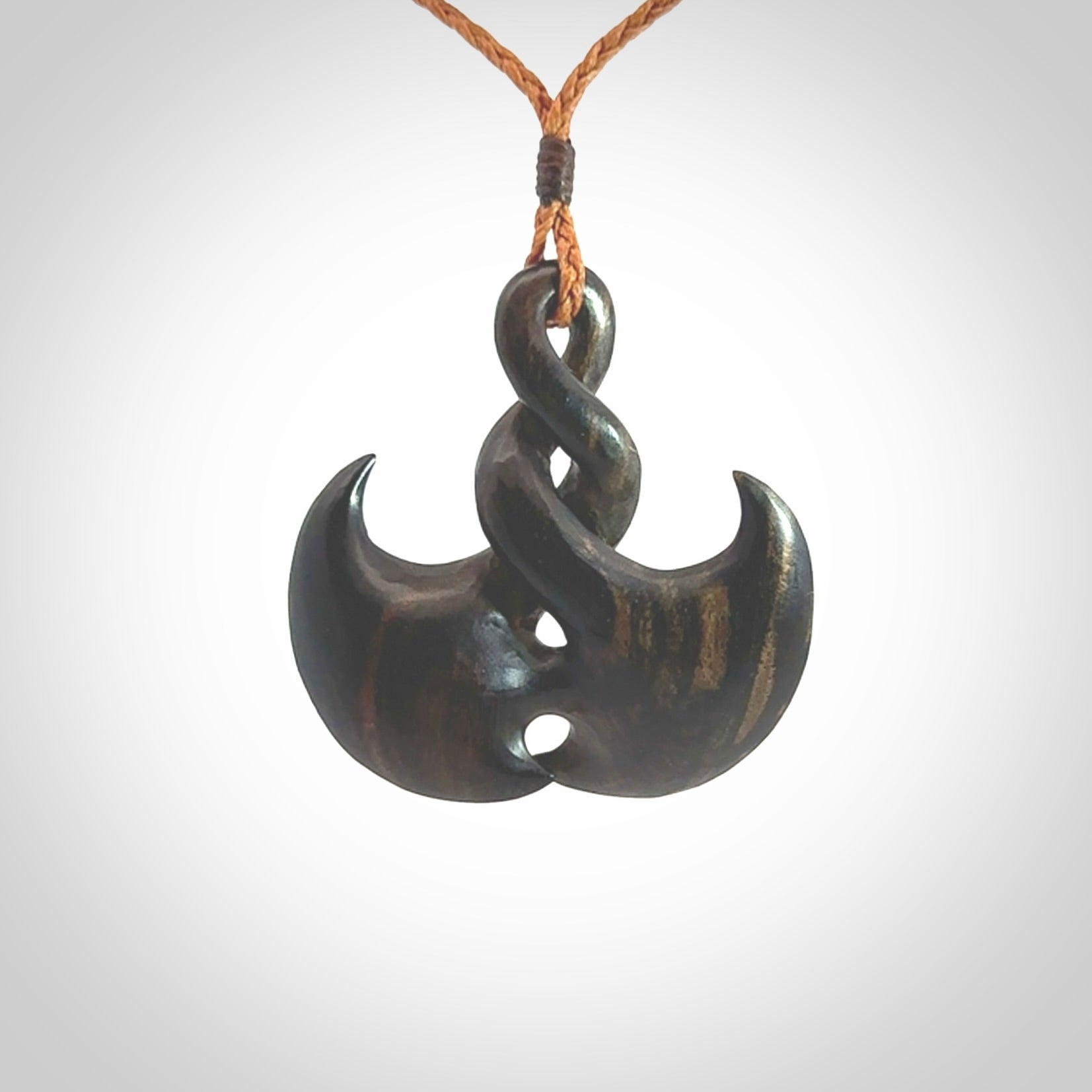 Hand carved hard wood contemporary twist pendant. Made by NZ Pacific. Shipping included in the price. Hand made hardwood twist necklace delivered on an adjustable cord.