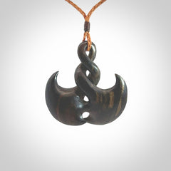 Hand carved hard wood contemporary twist pendant. Made by NZ Pacific. Shipping included in the price. Hand made hardwood twist necklace delivered on an adjustable cord.