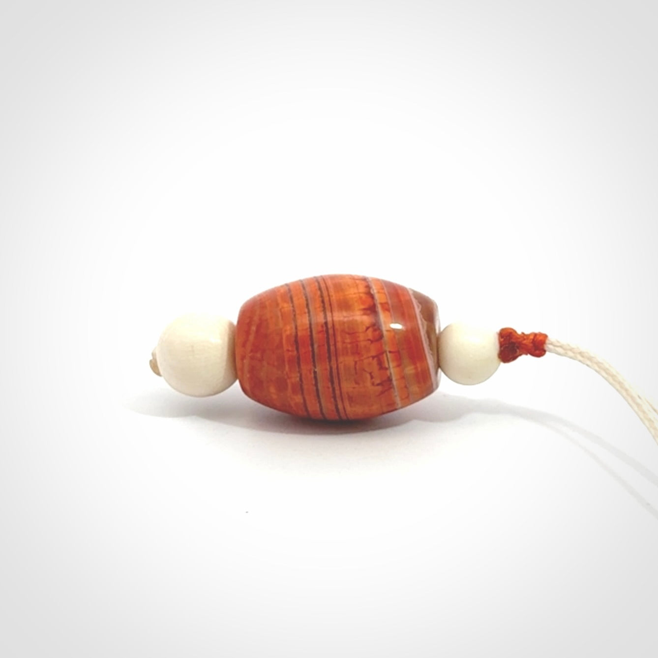 Snakeskin Agate contemporary drop pendant with woolly mammoth tusk beads. Hand carved for you by NZ Pacific.