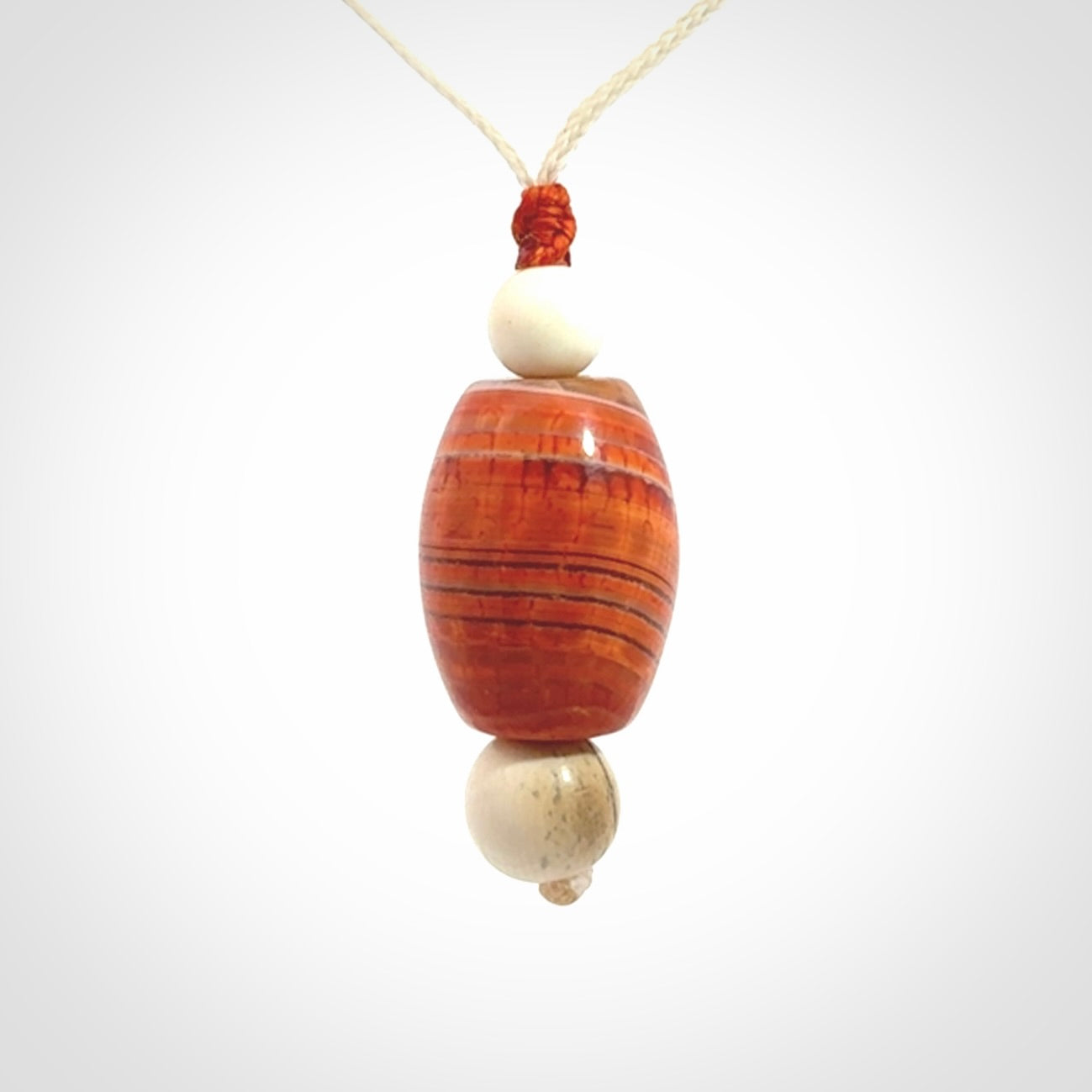 Snakeskin Agate contemporary drop pendant with woolly mammoth tusk beads. Hand carved for you by NZ Pacific.