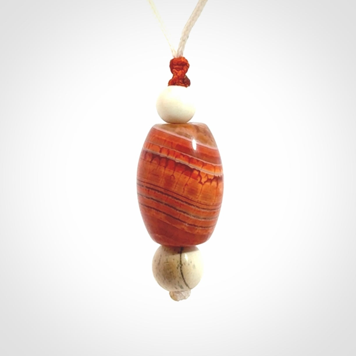 Snakeskin Agate contemporary drop pendant with woolly mammoth tusk beads. Hand carved for you by NZ Pacific.