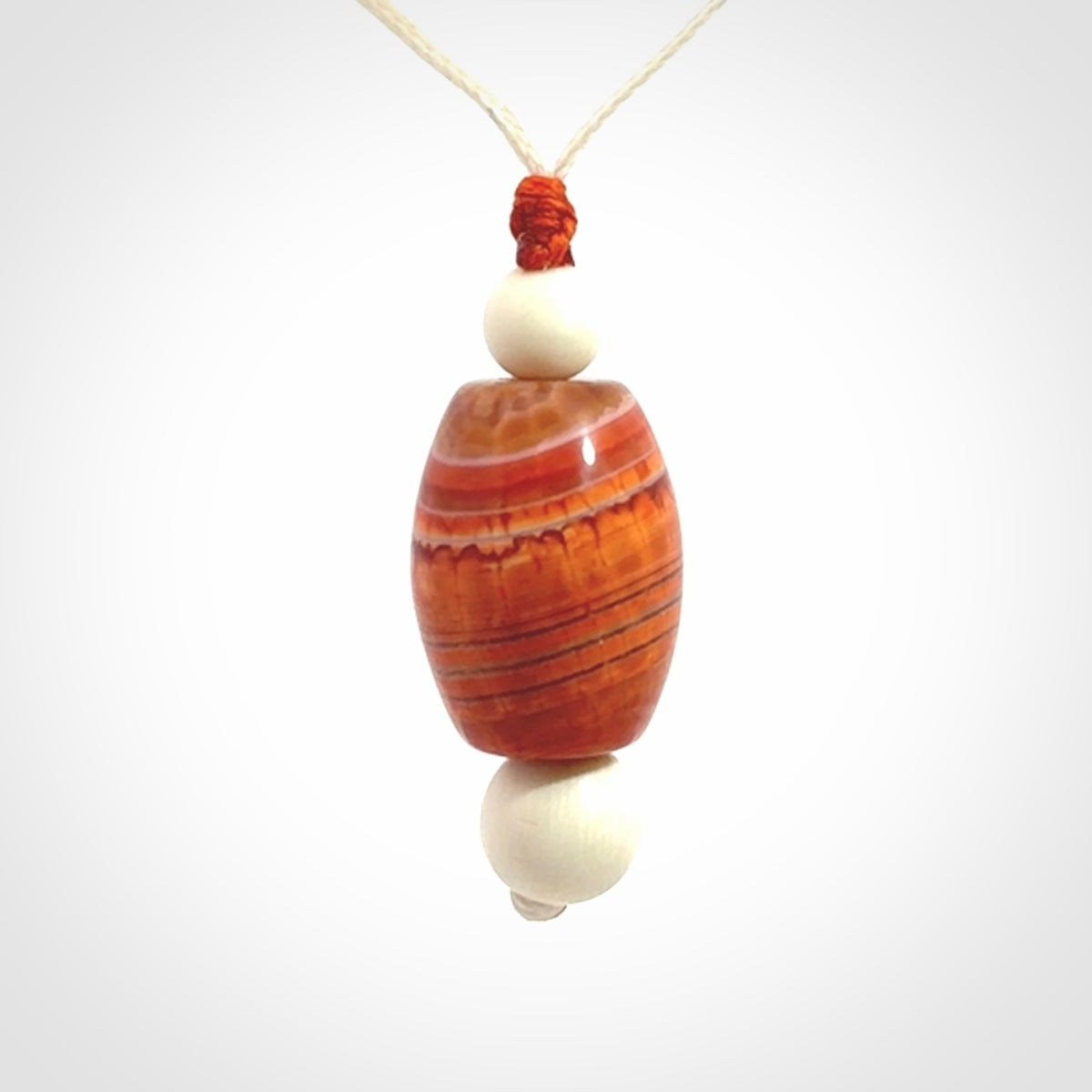 Snakeskin Agate contemporary drop pendant with woolly mammoth tusk beads. Hand carved for you by NZ Pacific.