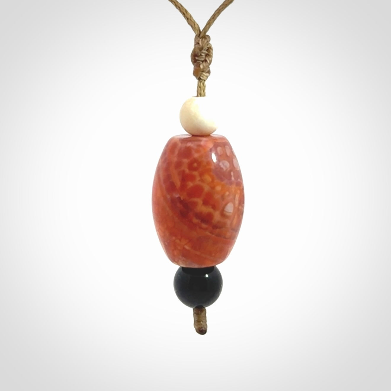 Snakeskin Agate contemporary drop pendant with black jade and woolly mammoth tusk beads. Hand carved for you by NZ Pacific.