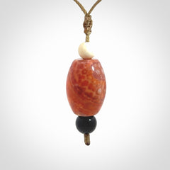 Snakeskin Agate contemporary drop pendant with black jade and woolly mammoth tusk beads. Hand carved for you by NZ Pacific.