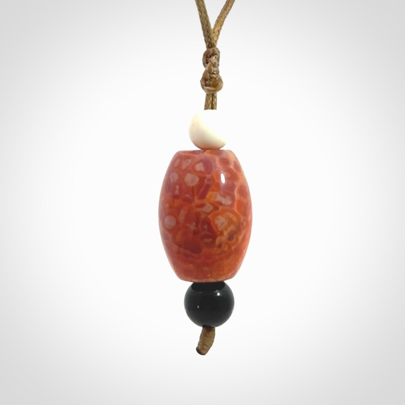 Snakeskin Agate contemporary drop pendant with black jade and woolly mammoth tusk beads. Hand carved for you by NZ Pacific.