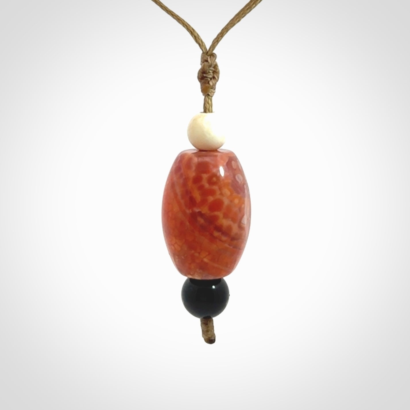 Snakeskin Agate contemporary drop pendant with black jade and woolly mammoth tusk beads. Hand carved for you by NZ Pacific.