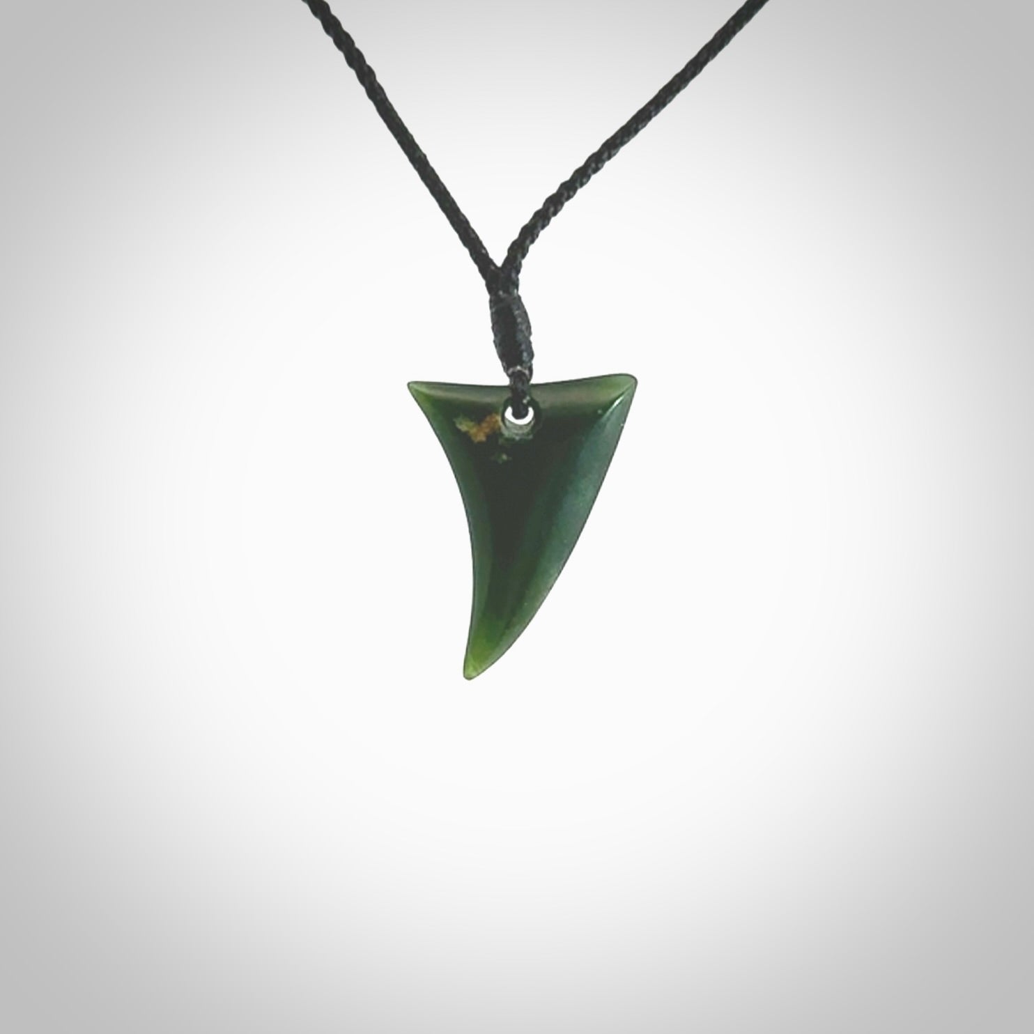 Hand carved pounamu drop pendant. Jade necklace hand made in New Zealand. A contemporary drop pendant carved from rare New Zealand jade. NZ Pacific jade jewellery for sale online.